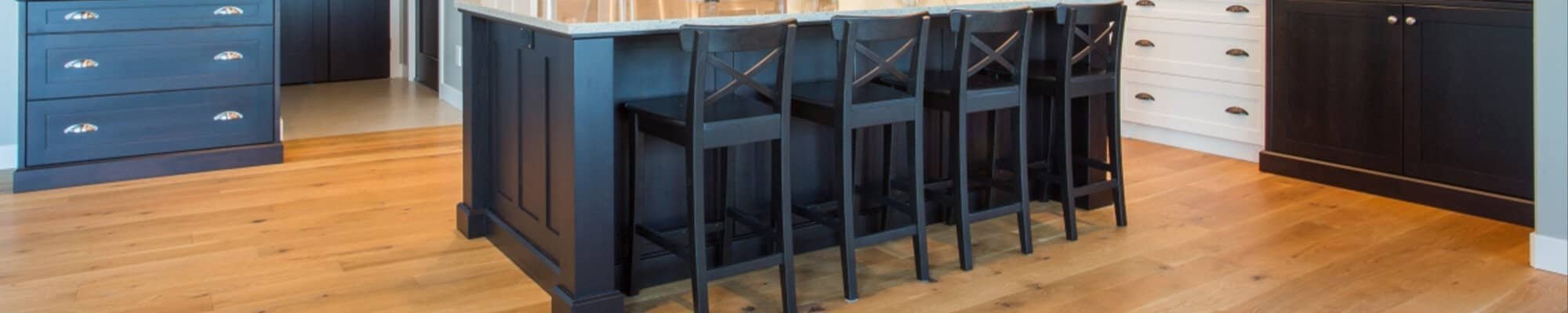 hardwood floors in traditional style kitchen with blue cupboards