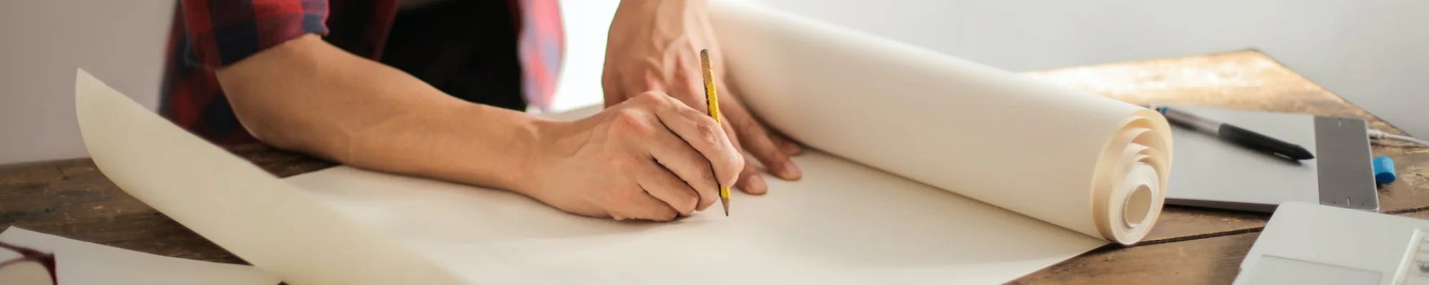 skilled professional drawing home renovation plans